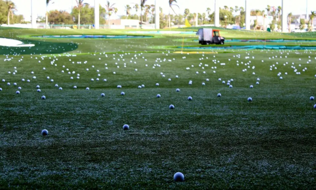A driving range filled with stray golf balls
