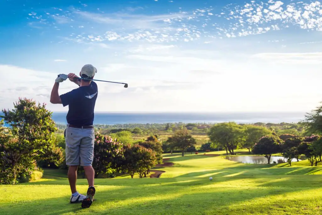 A golfer swinging his club