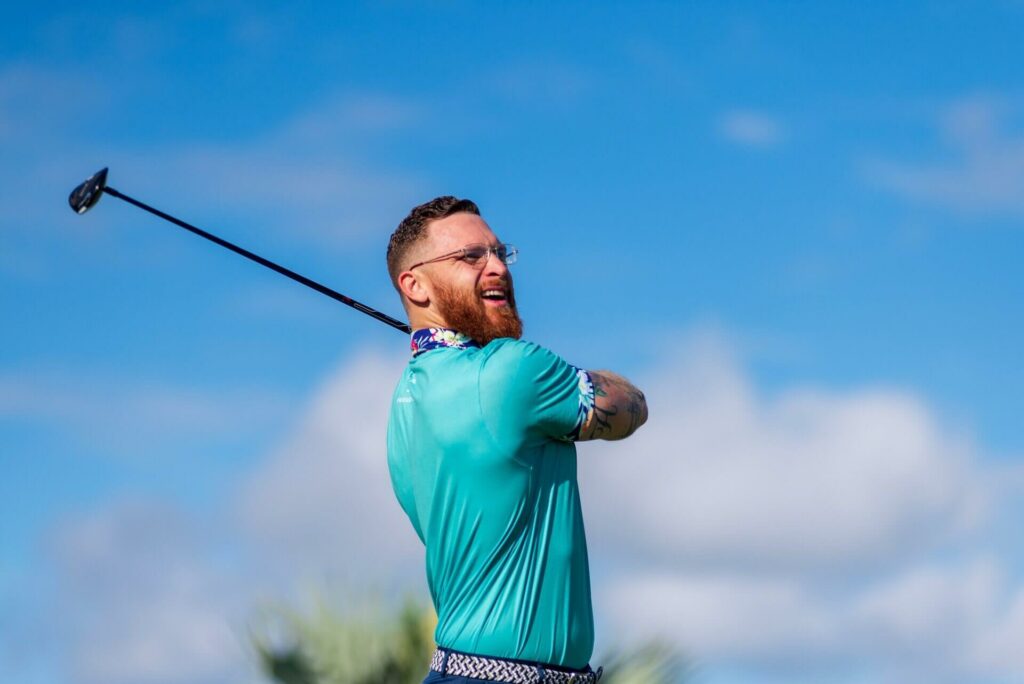 A man swinging a golf club