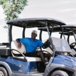 Golfer sitting in the golf cart