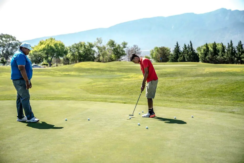 Two men playing golf