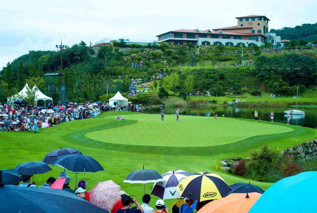 A view of spectators at a golf tournament and some stunning nature