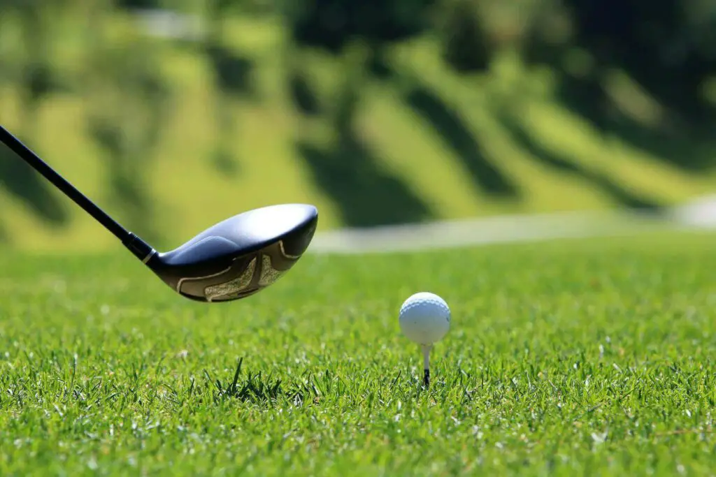 A wedge near a golf ball