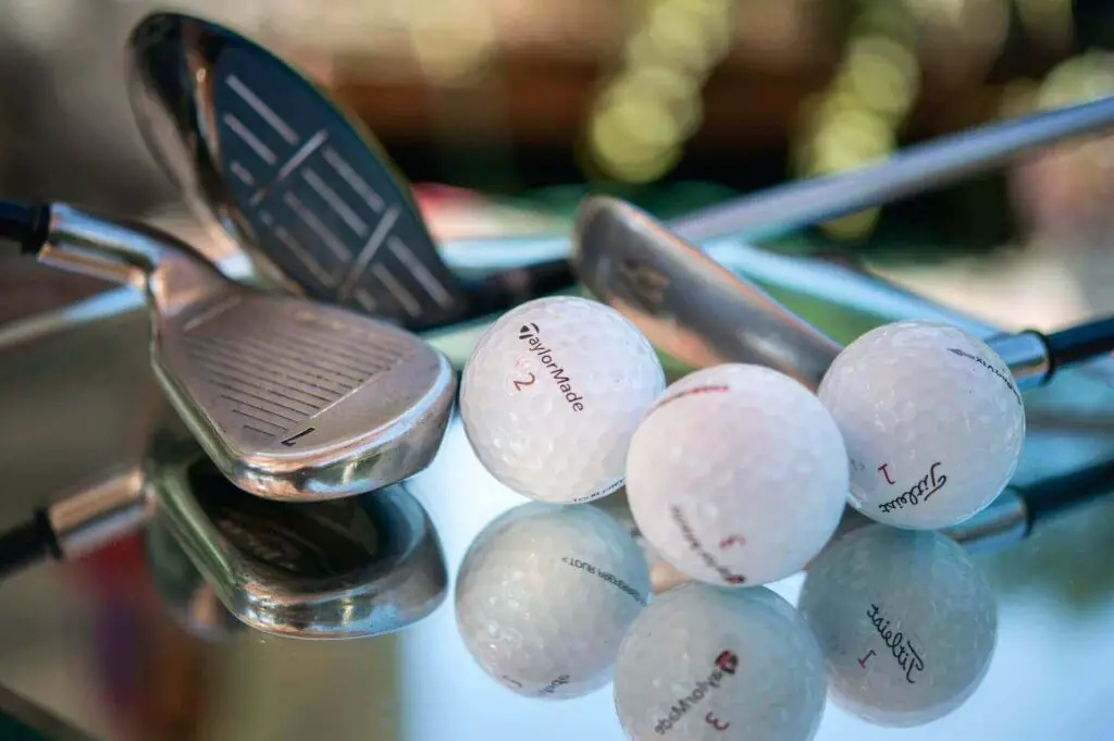 Some clubs and balls on a mirrored surface