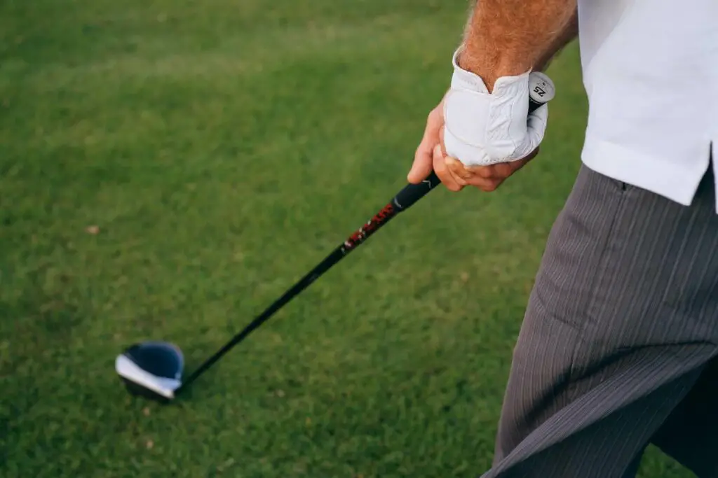 A man holding a golf driver