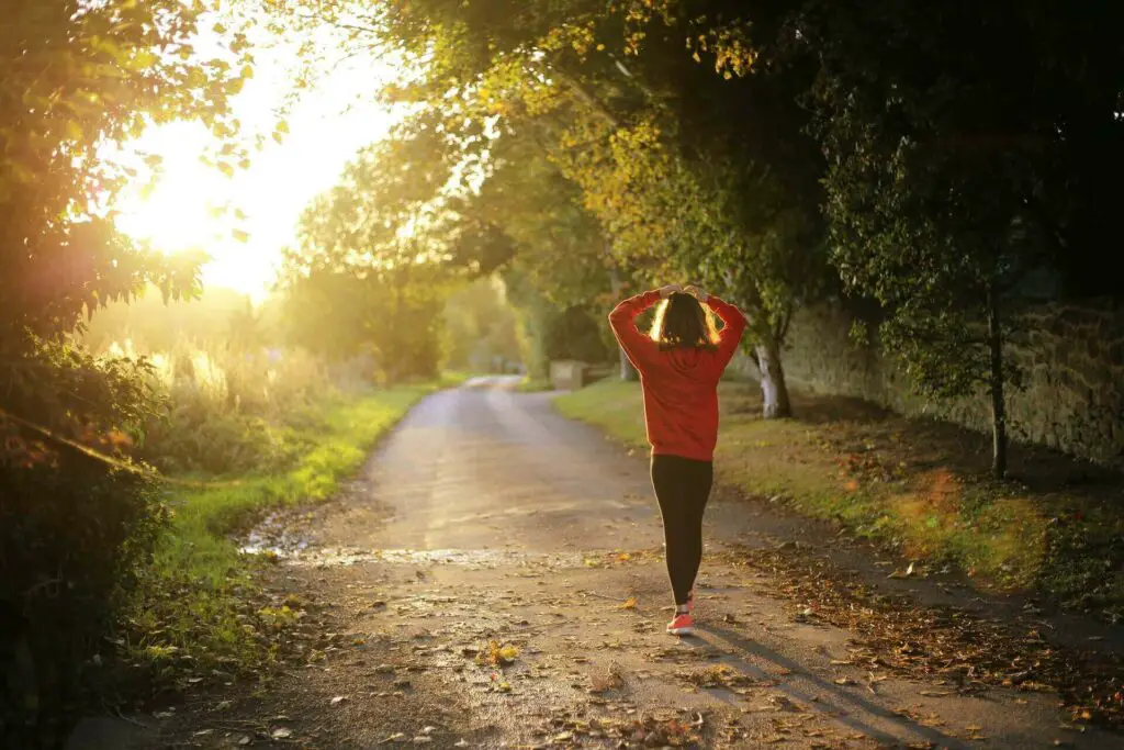 A woman walking near a golf course