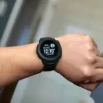 A person looking at their Garmin smartwatch
