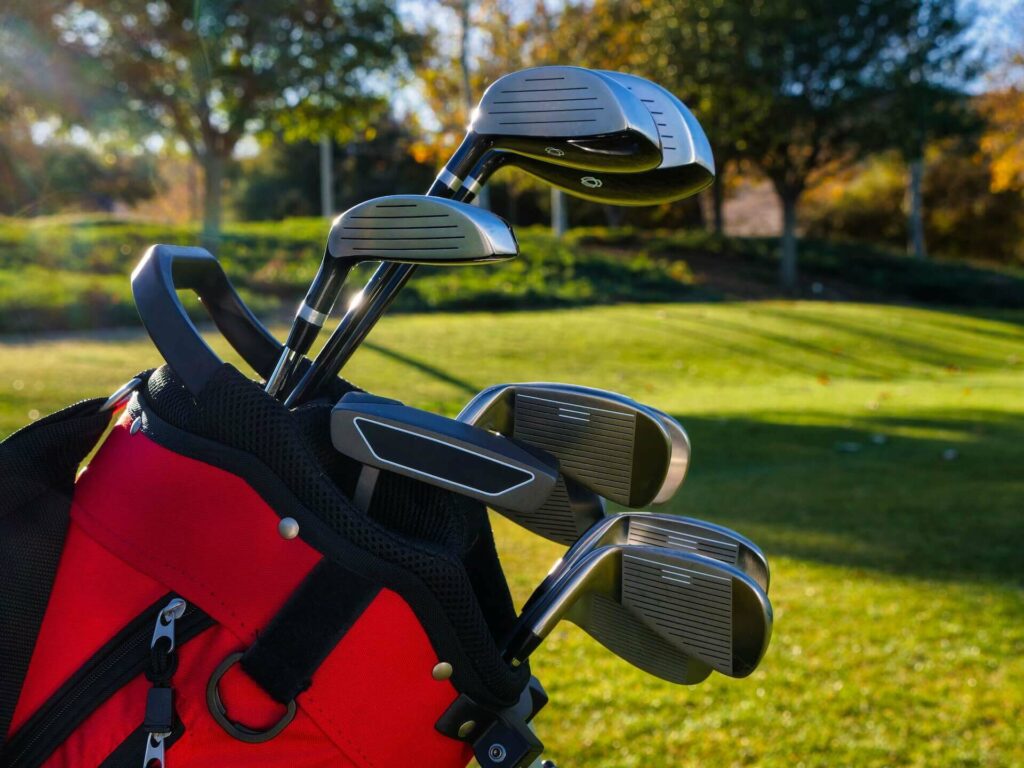 A close-up of a bag full of golf clubs
