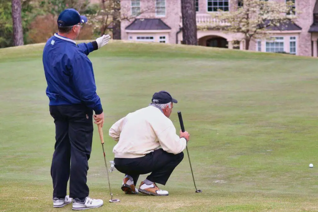 Two men playing golf