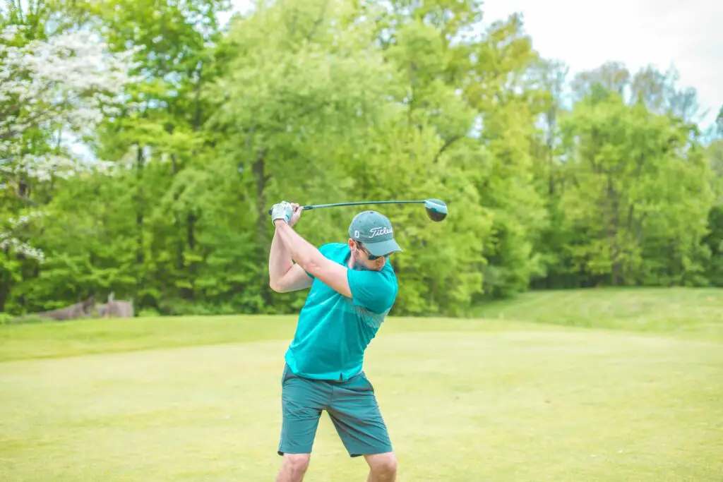 A golfer swinging a golf club