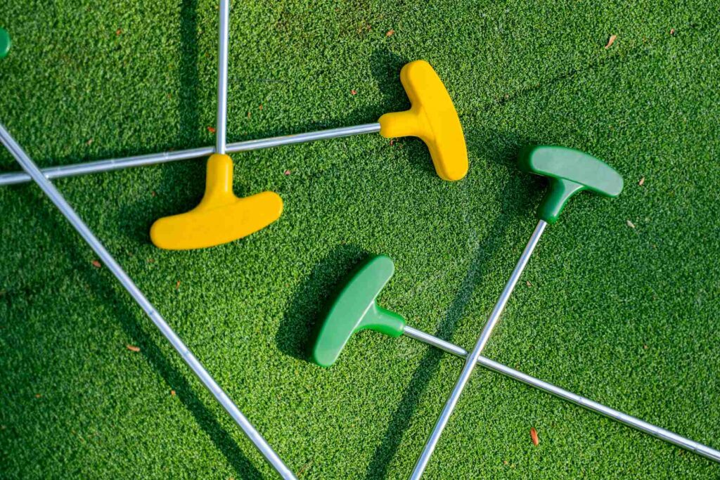 A bunch of miniature golfing clubs