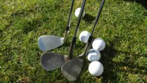 Wedges and balls on a golf course