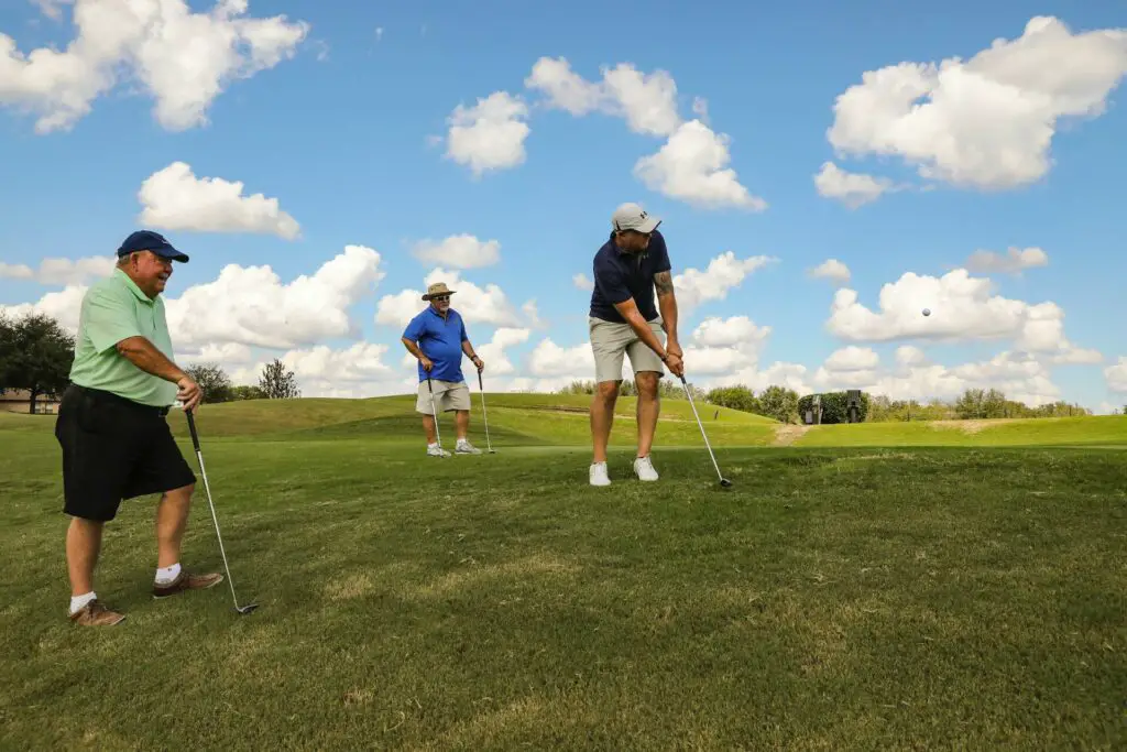 Men playing golf