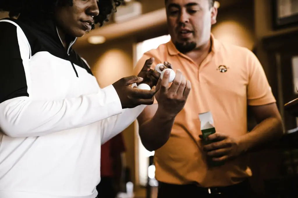 Man and woman looking at golf balls